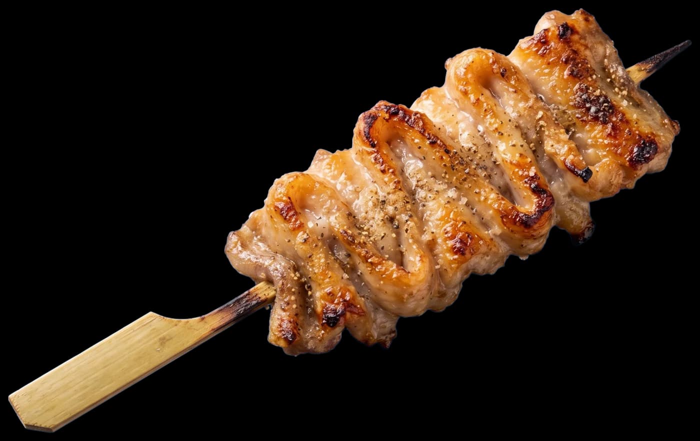 A kawa skewer: chicken skin folded onto the skewer and salt-grilled until crisp