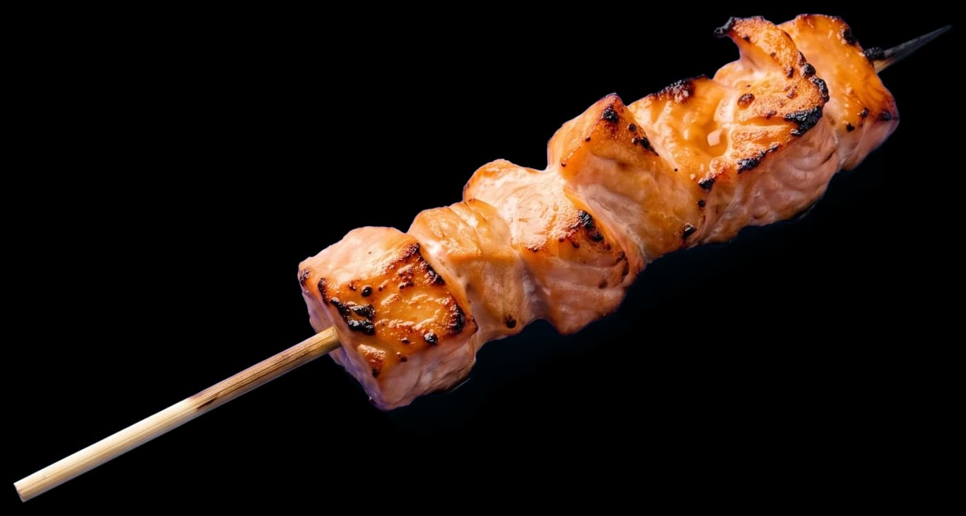 A wild salmon skewer, salt-grilled with a little char